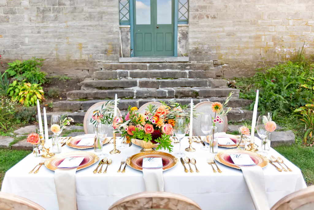Luxury elopement table setting with Tuscan flowers and wine