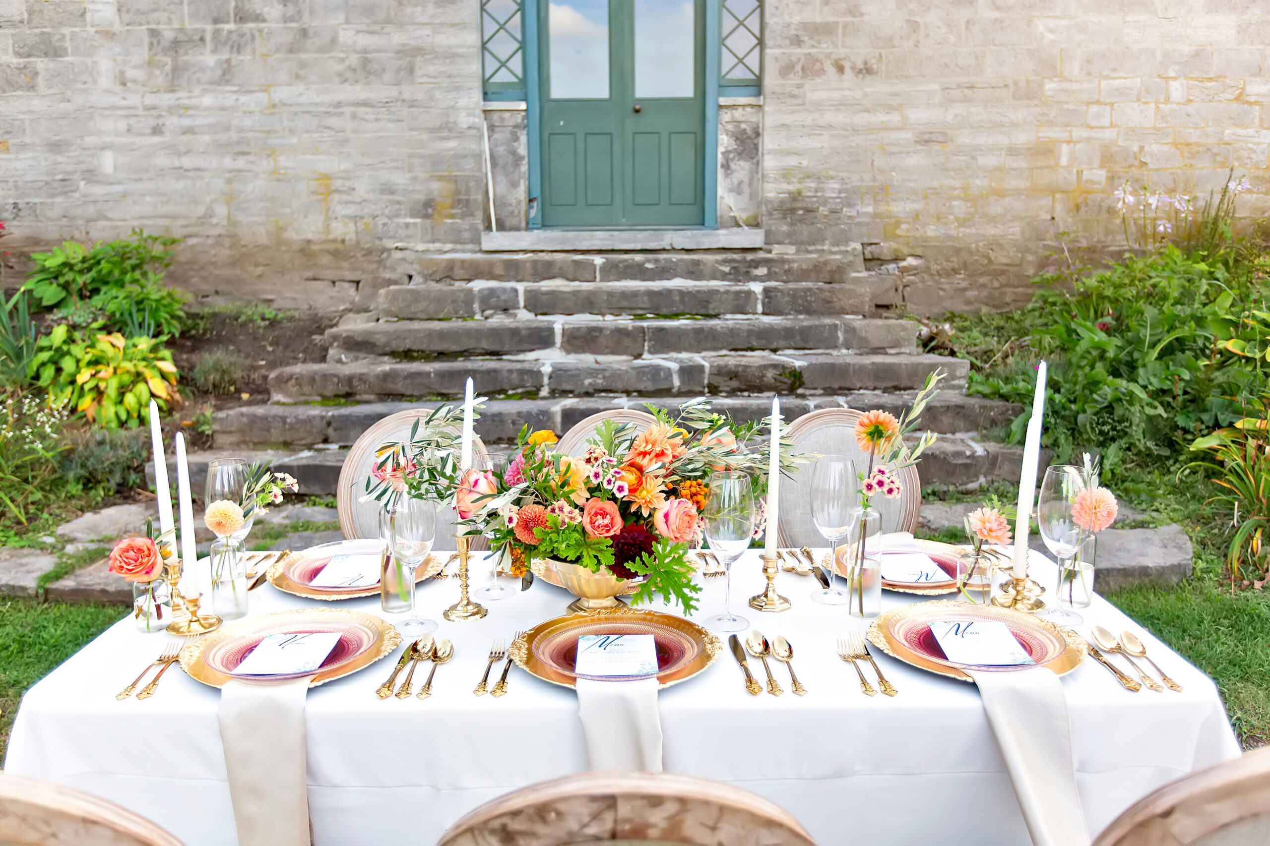 Luxury elopement table setting with Tuscan flowers and wine